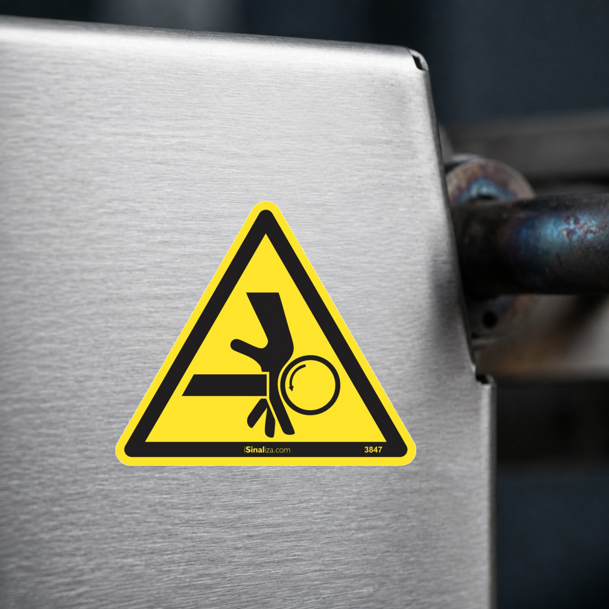 Close-up de etiqueta aplicada em máquina ou equipamento industrial (até 8 × 8 cm) - Etiqueta de Segurança "Ponto de Esmagamento" - (Embalagem com 10 unidades)